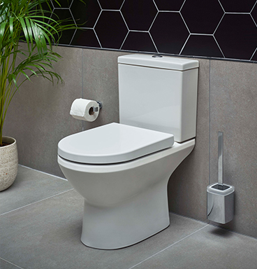 VitrA Integra comfort height toilet against mosaic tiled background